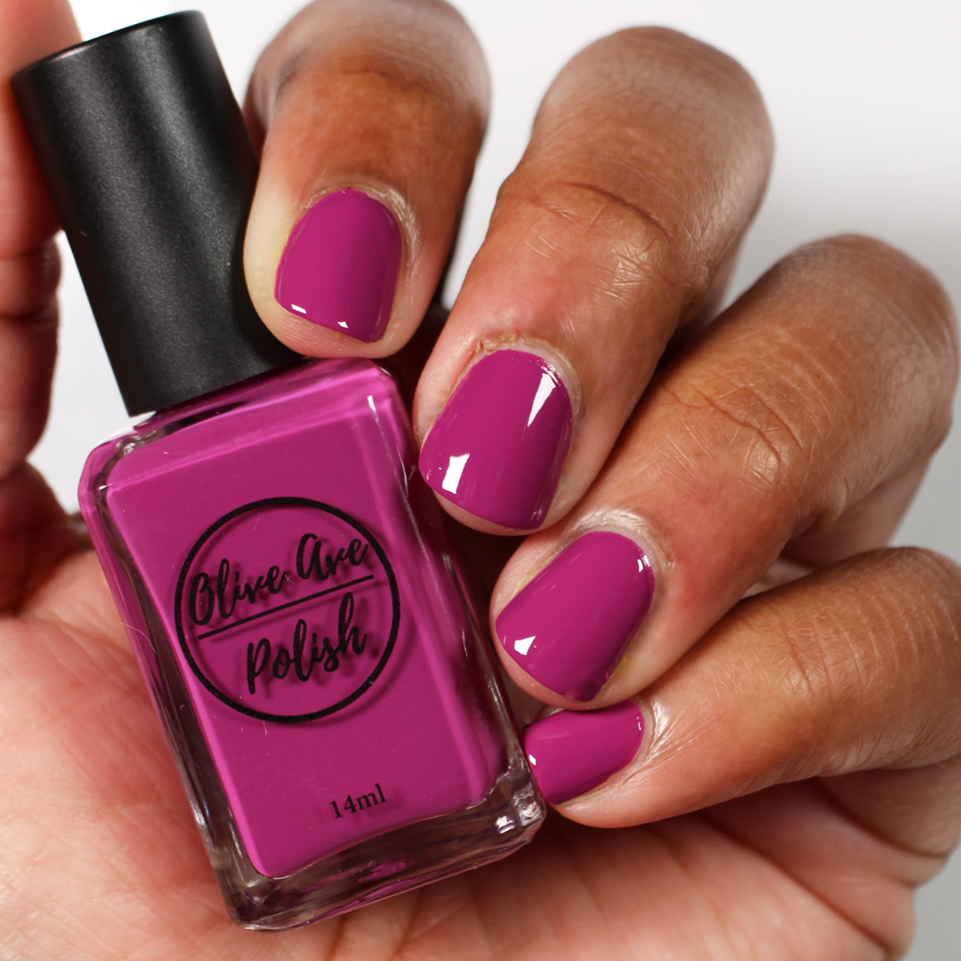 magenta nail polish on medium dark skin tone