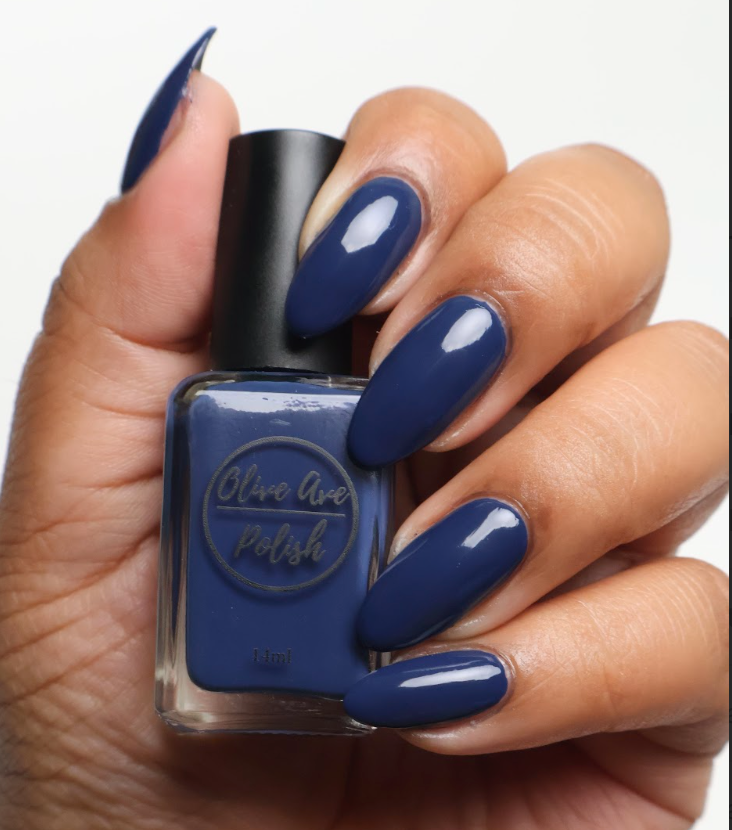navy blue nail polish on medium skin tone