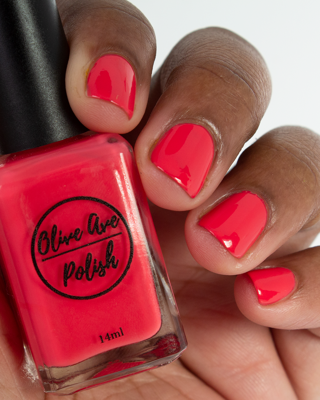 summer red nail polish swatch on medium skin tone