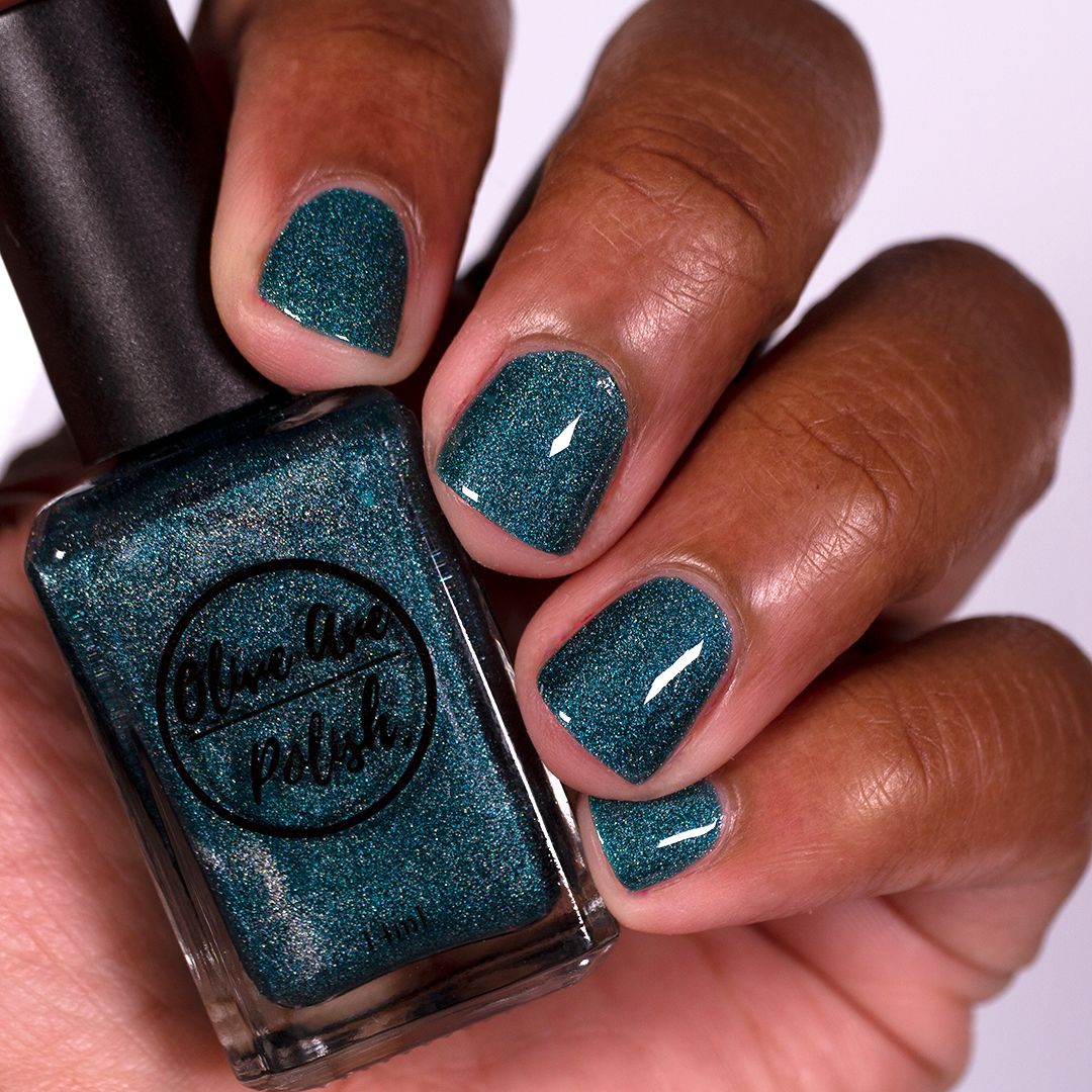 Teal Blue holographic nail polish swatch on medium dark skin tone