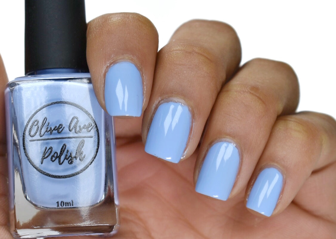 Periwinkle nail polish swatch on medium skin tone