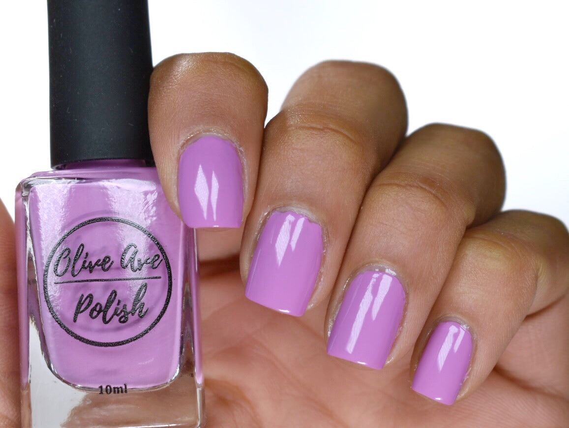 light purple nail polish swatch on medium skin tone