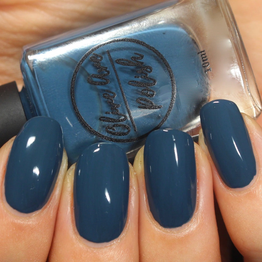 Peacock blue nail polish swatch on pale skin tone
