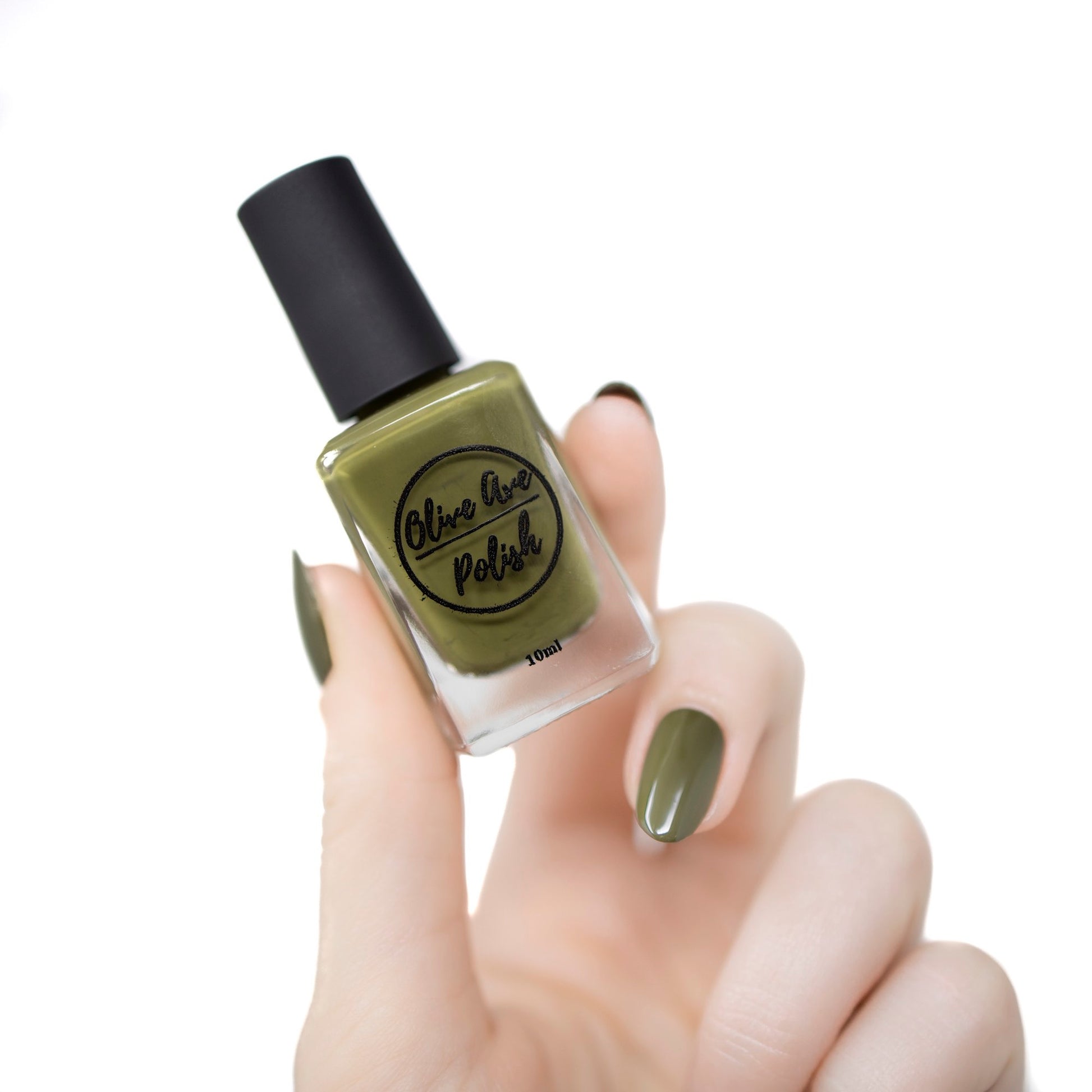 olive green nail polish swatch on pale skin tone