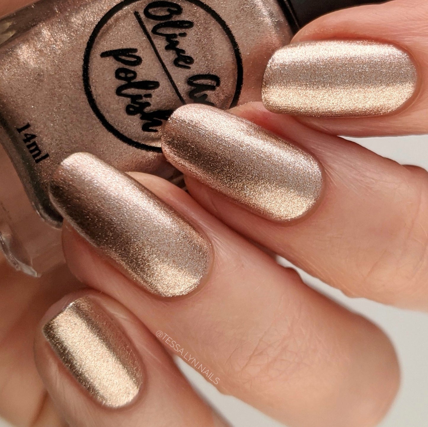 rose gold nail polish swatch on pale skin tone