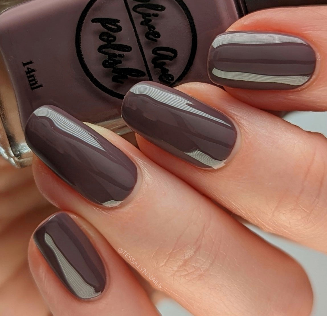 purple grey nail polish swatch on pale skin tone