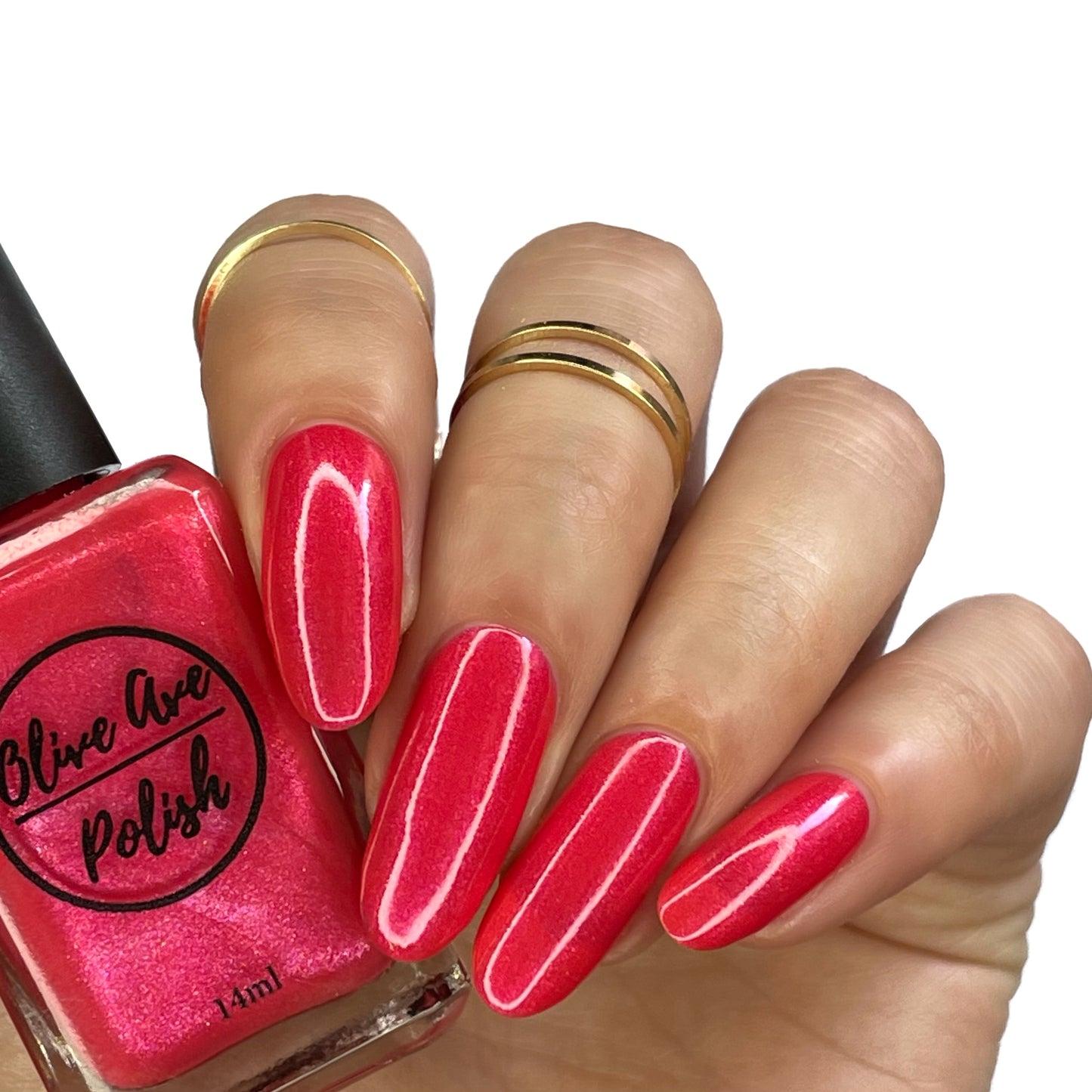 coral shimmer nail polish swatch on pale skin tone