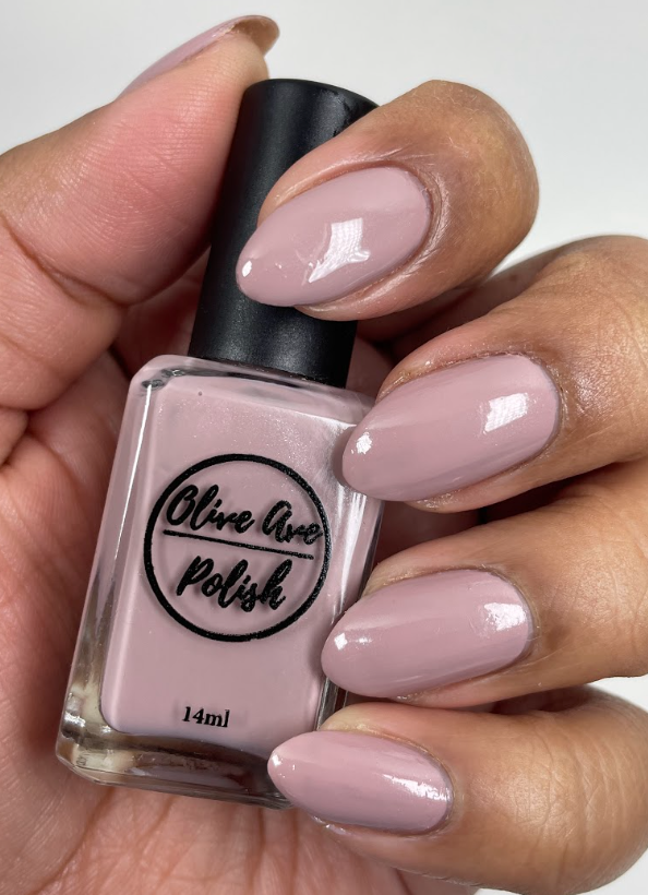 Shimmery taupe nail polish swatch on medium skin tone