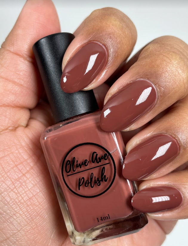 Fall brown nail polish swatch on medium skin tone