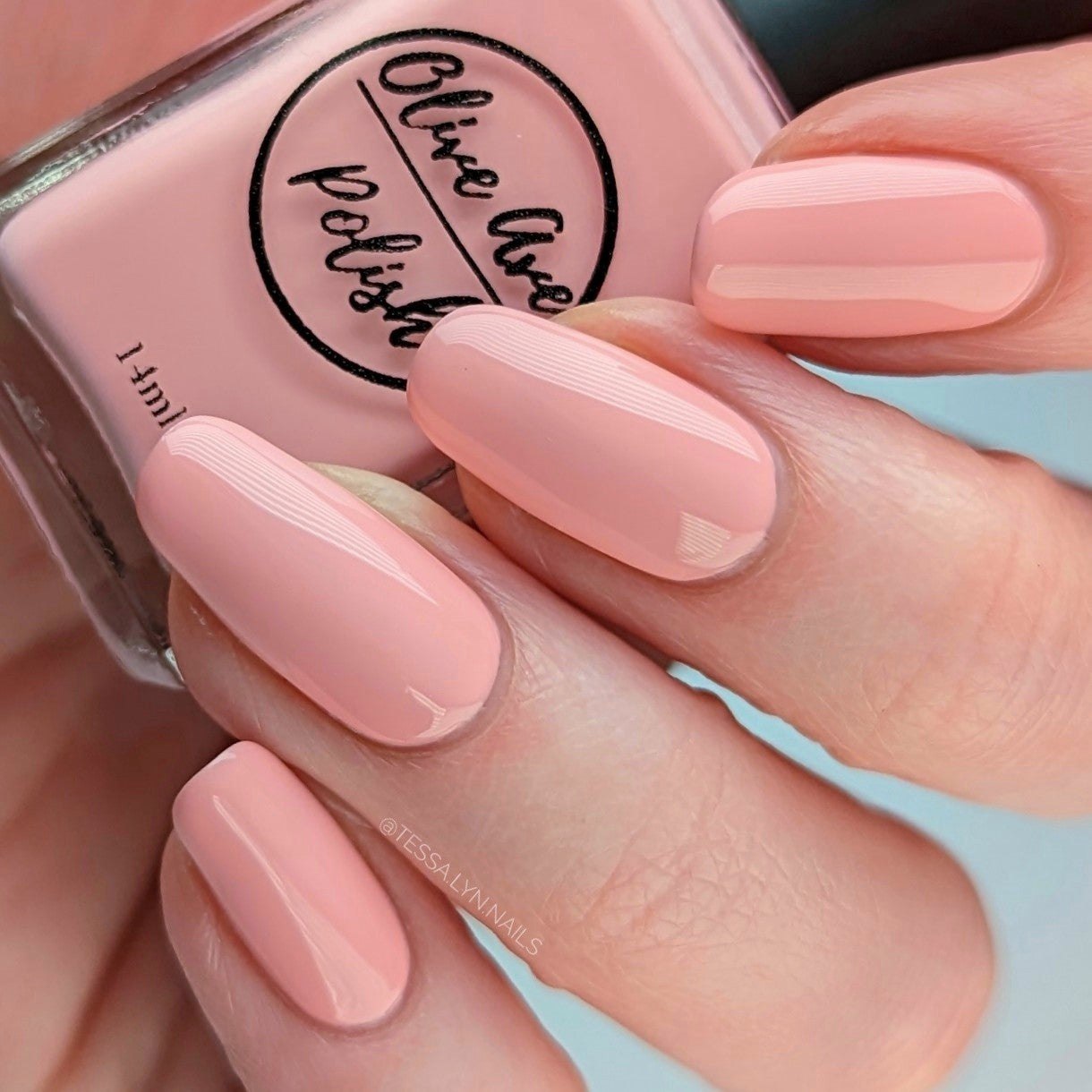 pastel coral nail polish swatch on pale skin tone