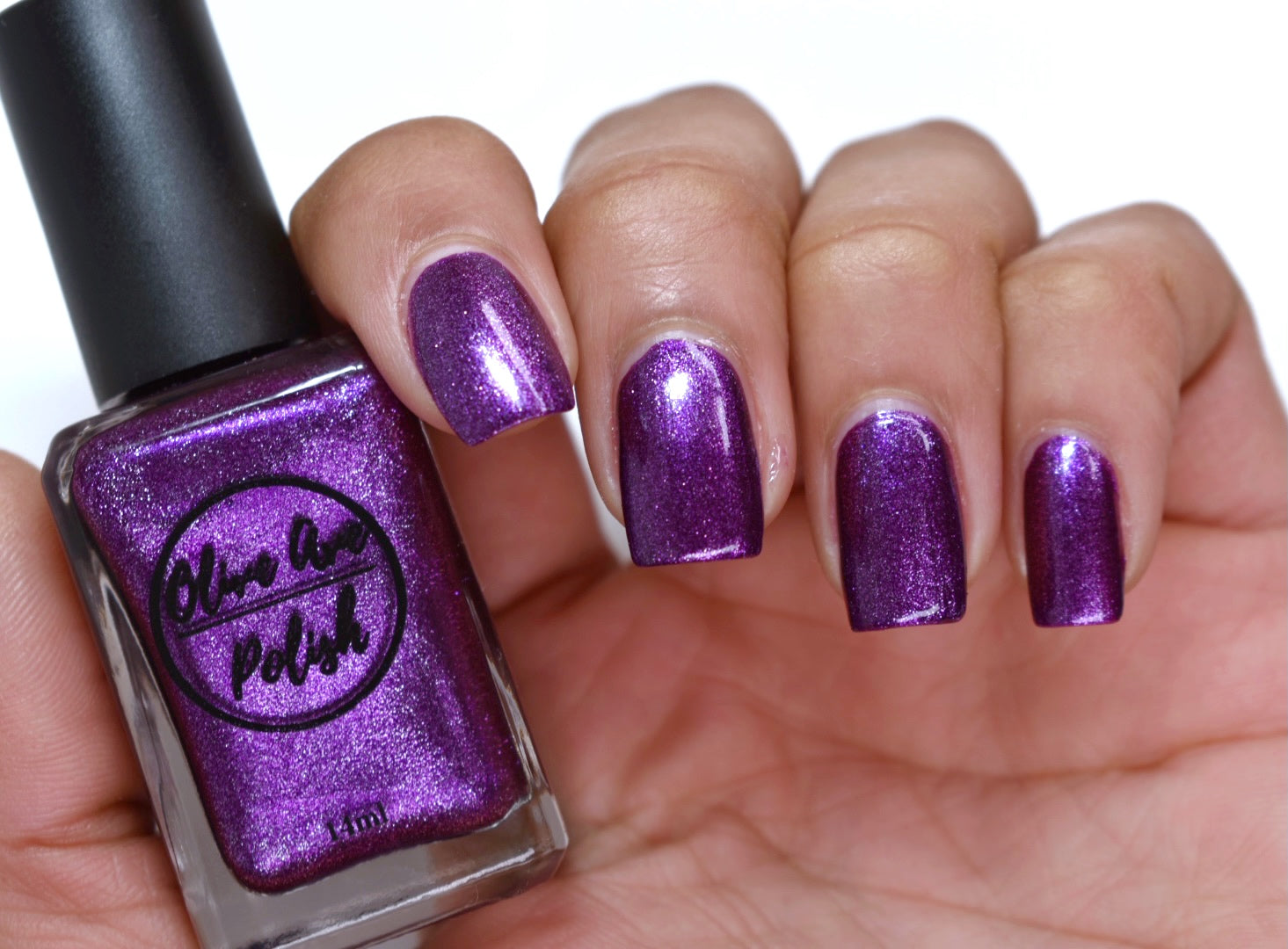 purple metallic nail polish swatch on pale skin tone