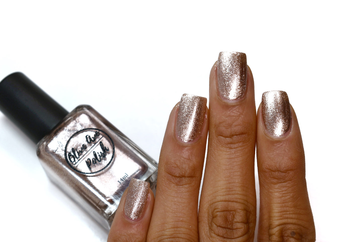 rose gold nail polish swatch on medium skin tone