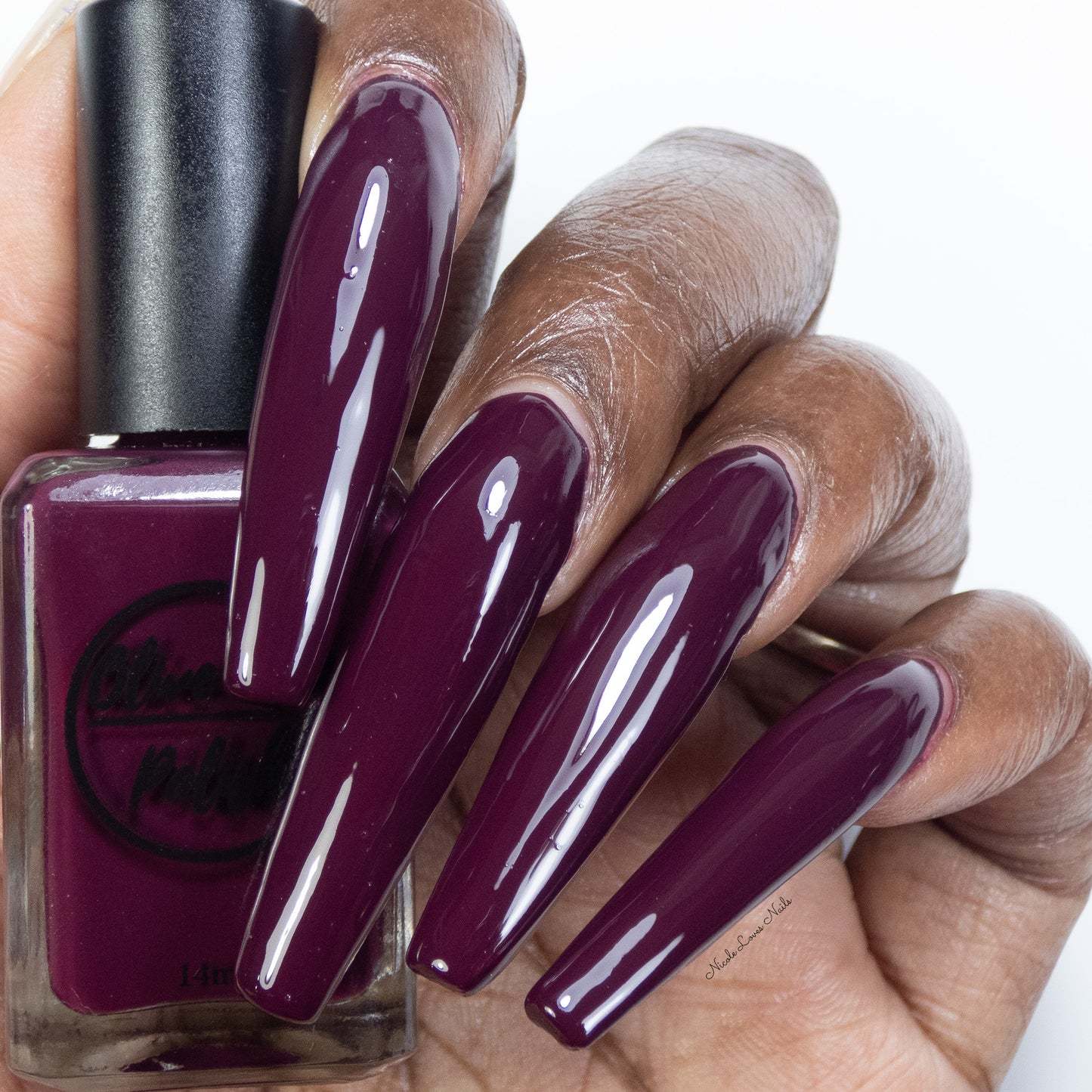 wine red nail polish swatch on dark skin tone