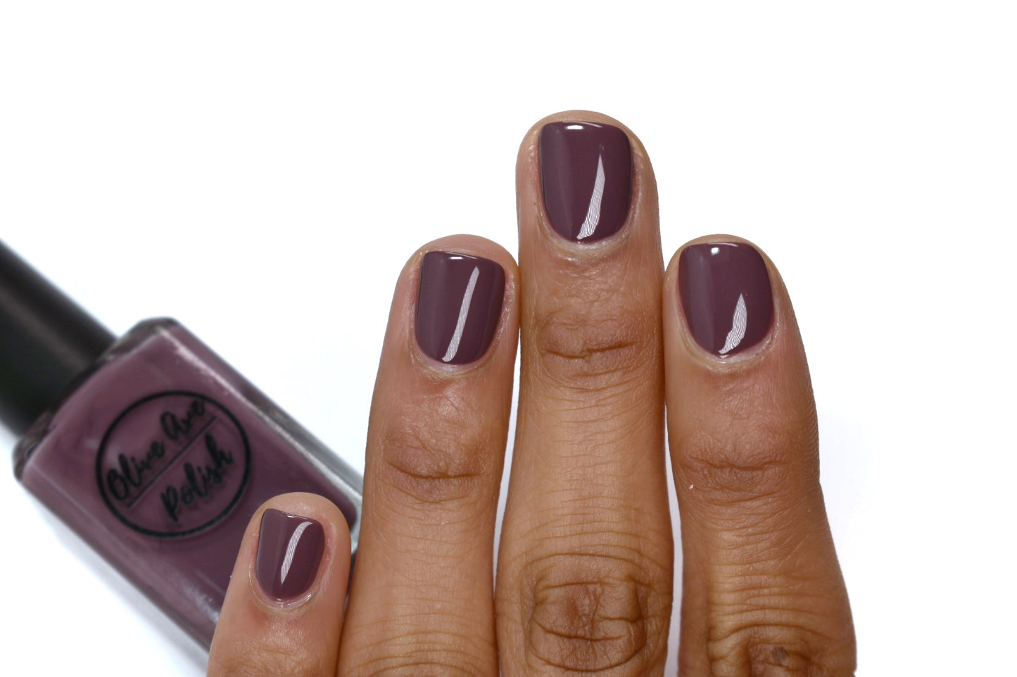 purple grey nail polish swatch on medium skin tone