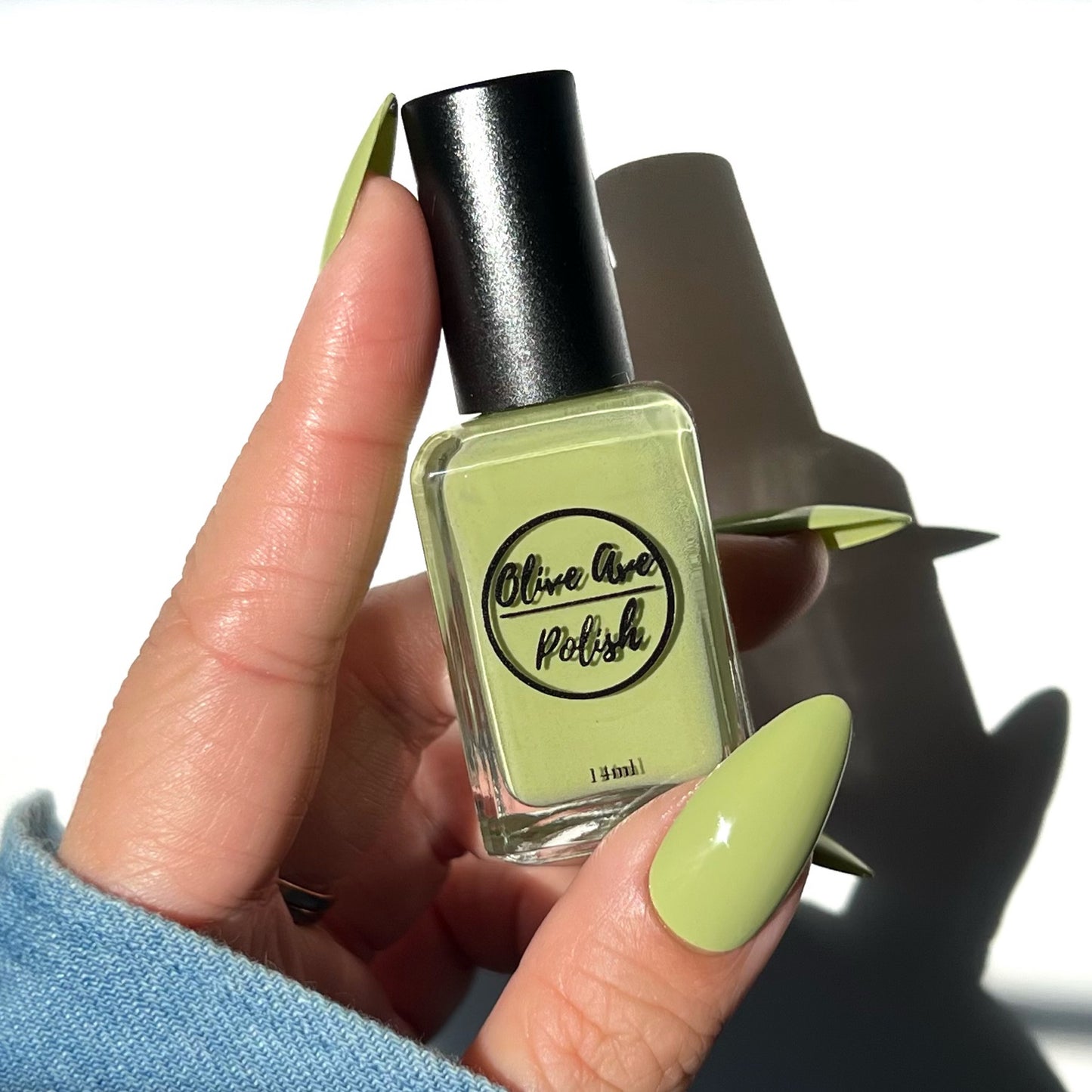 pastel green nail polish swatch on pale skin tone