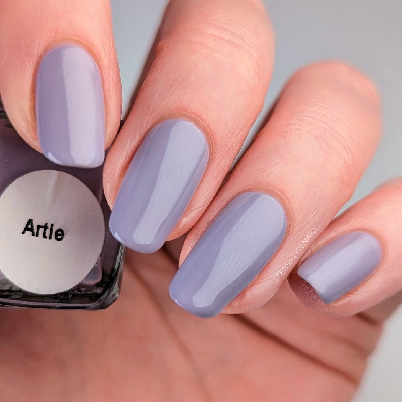 purple grey nail polish swatch on pale skin tone