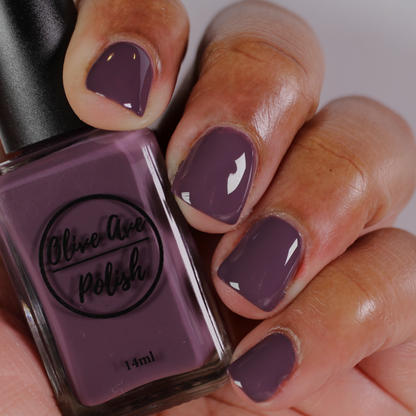 heather purple nail polish on dark skin tone