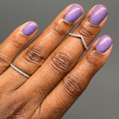 Warm purple with golden glow cream nail polish on dark skin