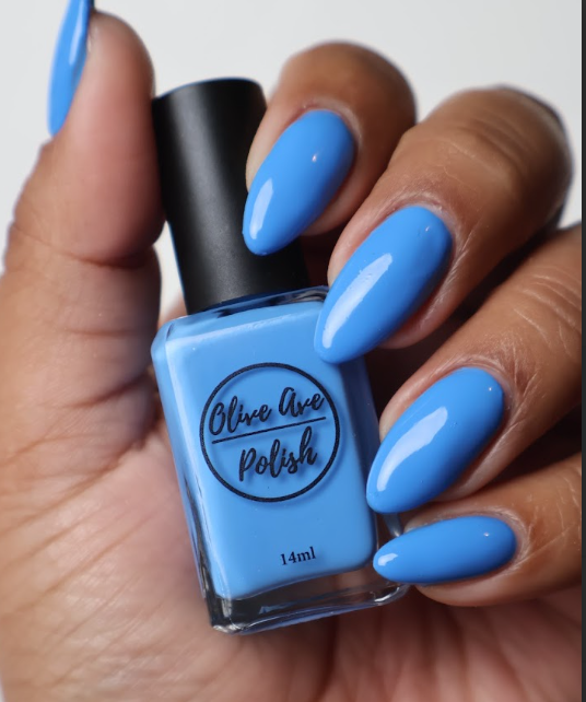 Bright Sky Blue nail polish swatch on medium skin tone