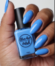 Load image into Gallery viewer, Bright Sky Blue nail polish swatch on medium skin tone