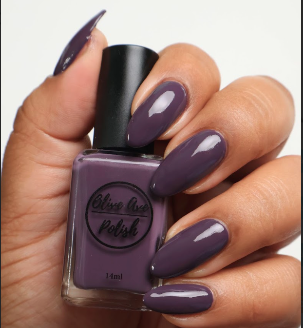 heather purple nail polish on medium skin tone