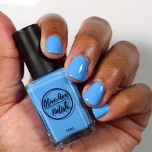Load image into Gallery viewer, Bright Sky Blue nail polish swatch on medium skin tone