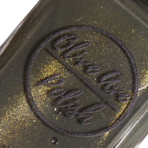 forest green nail polish bottle close up