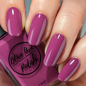 magenta nail polish swatch on pale skin tone