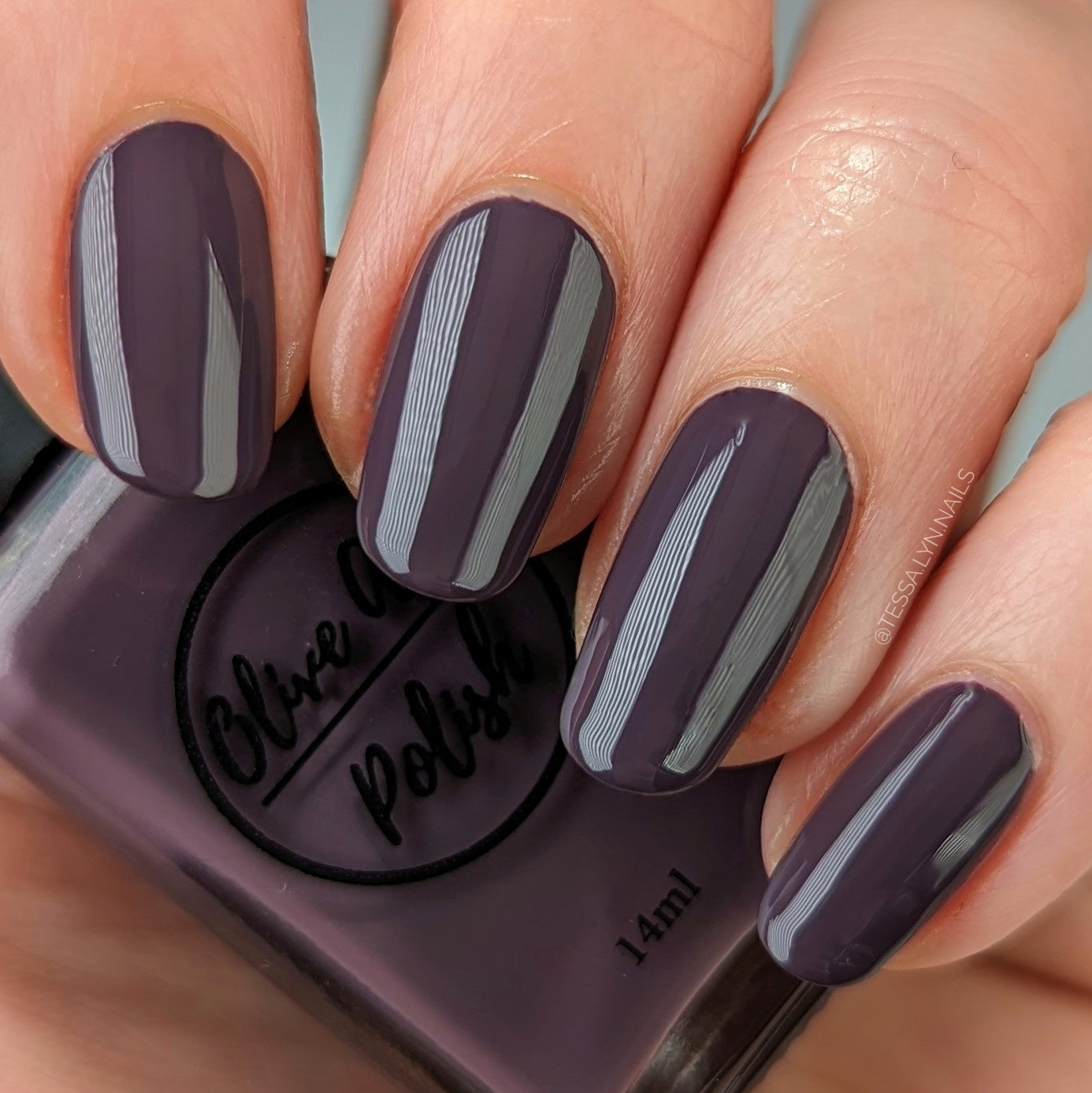heather purple nail polish on pale skin tone