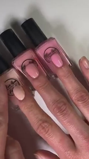 comparisons of three different light pink creams on the nails