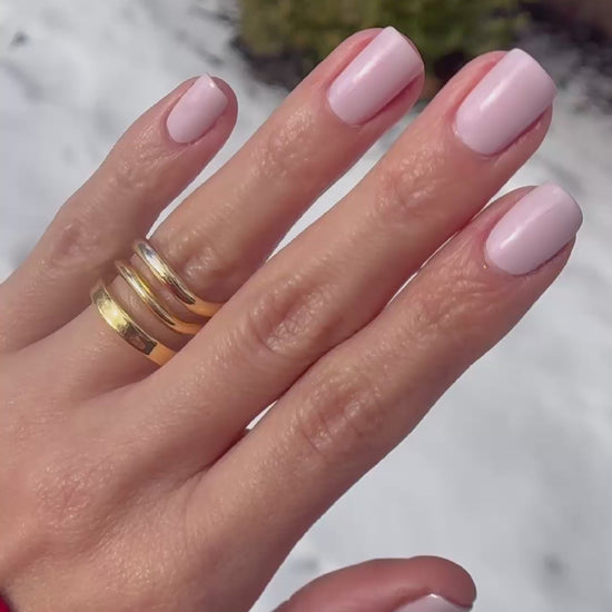 Pale pink lavender nail polish in sun and indoors