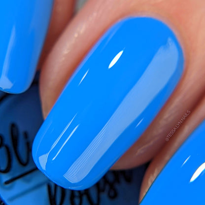 Bright Sky Blue nail polish swatch on pale skin tone