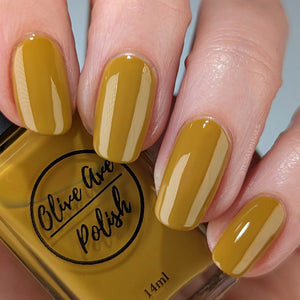 mustard yellow nail polish on pale skin tone