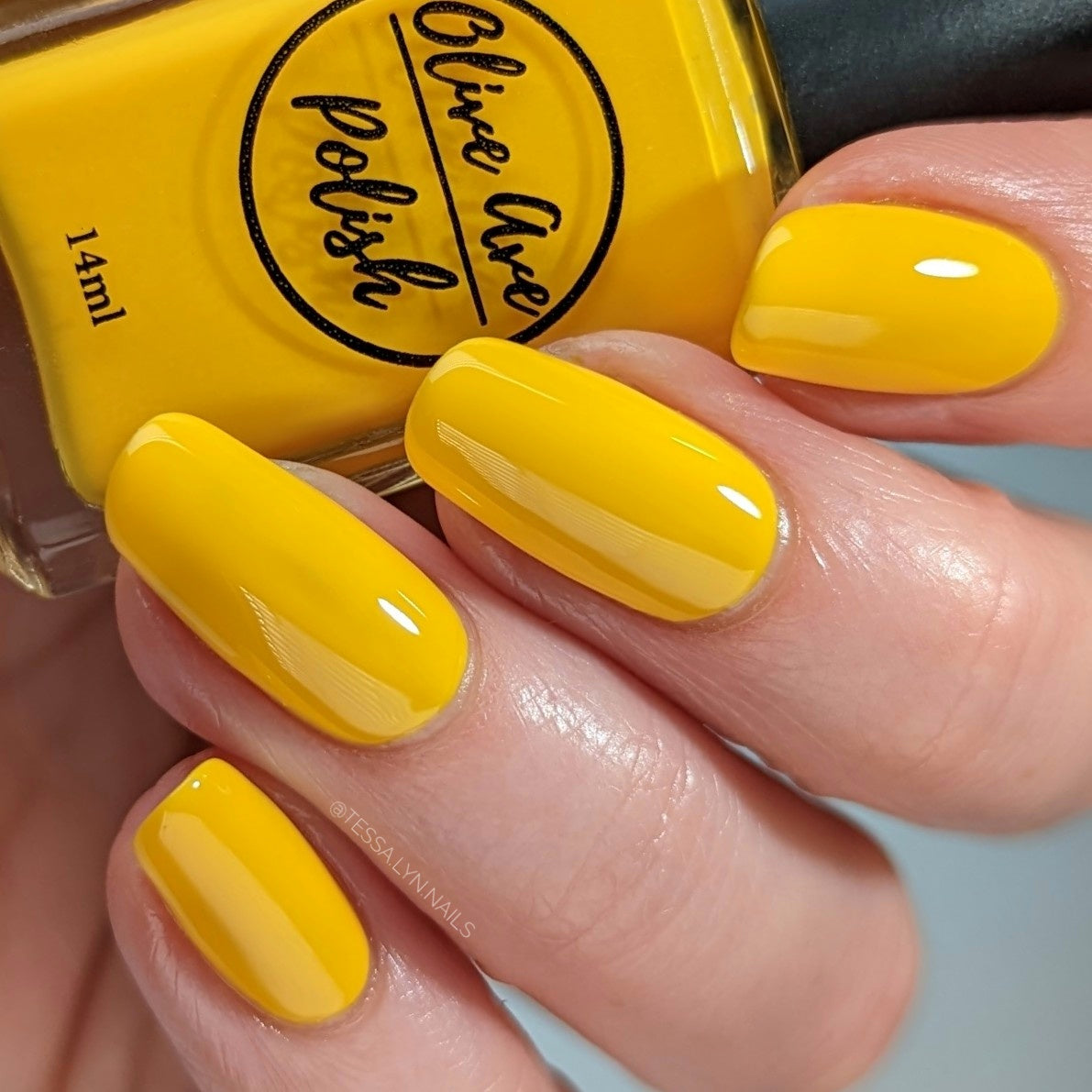 sunny yellow nail polish swatch on pale skin tone