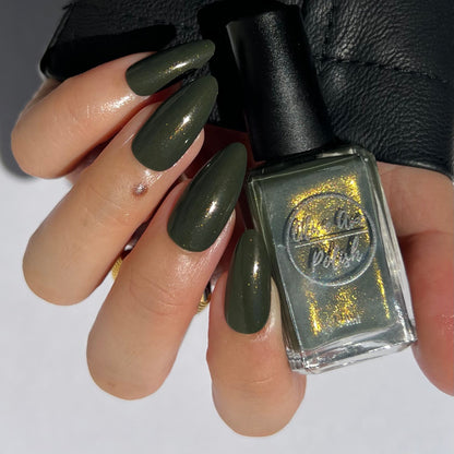 forest green nail polish with gold shimmer on asian skin tone