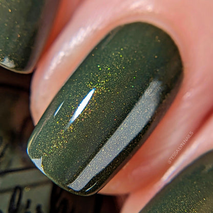 forest green nail polish with gold shimmer macro