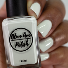 Load image into Gallery viewer, Off white nail polish swatch on medium dark skin tone