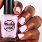 Light purple shimmer nail polish swatch on medium dark skin tone