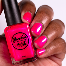Load image into Gallery viewer, Pink glitter nail polish swatch on medium dark skin tone