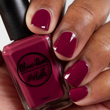 Load image into Gallery viewer, brick red nail polish swatch on medium skin tone