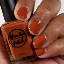 Load image into Gallery viewer, Fall orange nail polish swatch on medium dark skin tone