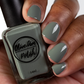 sage green nail polish swatch on medium skin tone