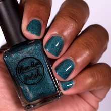 Load image into Gallery viewer, Teal Blue holographic nail polish swatch on medium dark skin tone