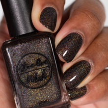 Load image into Gallery viewer, brown holographic nail polish swatch on medium skin tone