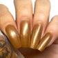 Bronze nail polish swatch on pale skin tone