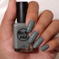sage green nail polish swatch on pale skin tone