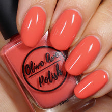Load image into Gallery viewer, Bright coral nail polish swatch on pale skin tone