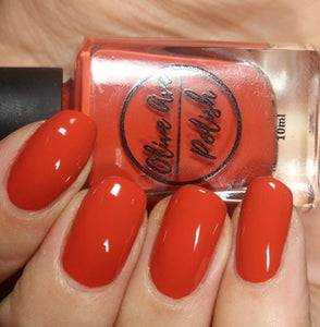 fall red nail polish swatch on pale skin tone