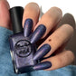 Purple holographic nail polish swatch on pale skin tone