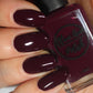 wine red nail polish swatch on pale skin tone